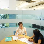 two_ladies_in_a_meeting_looking_at_paperwork